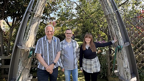 East Marsh Liberal Democrat councillors Steve Beasant, Loyd Emmerson and Nicola Aisthorpe standing beneath the historic whale jawbones at Your Place Grimsby.
