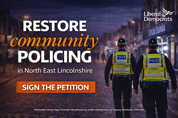 Restore Community Policing campaign graphic showing two police officers walking on a street at night.