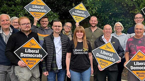 Group of local Liberal Democrat campaigners in North East Lincolnshire holding “Winning Here” signs during the 2026 local election campaign