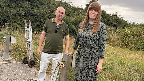 Cllr Nicola Aisthorpe and Lib Dem campaigner Brian Barrett beside a working water standpipe at Carr Lane allotments.
